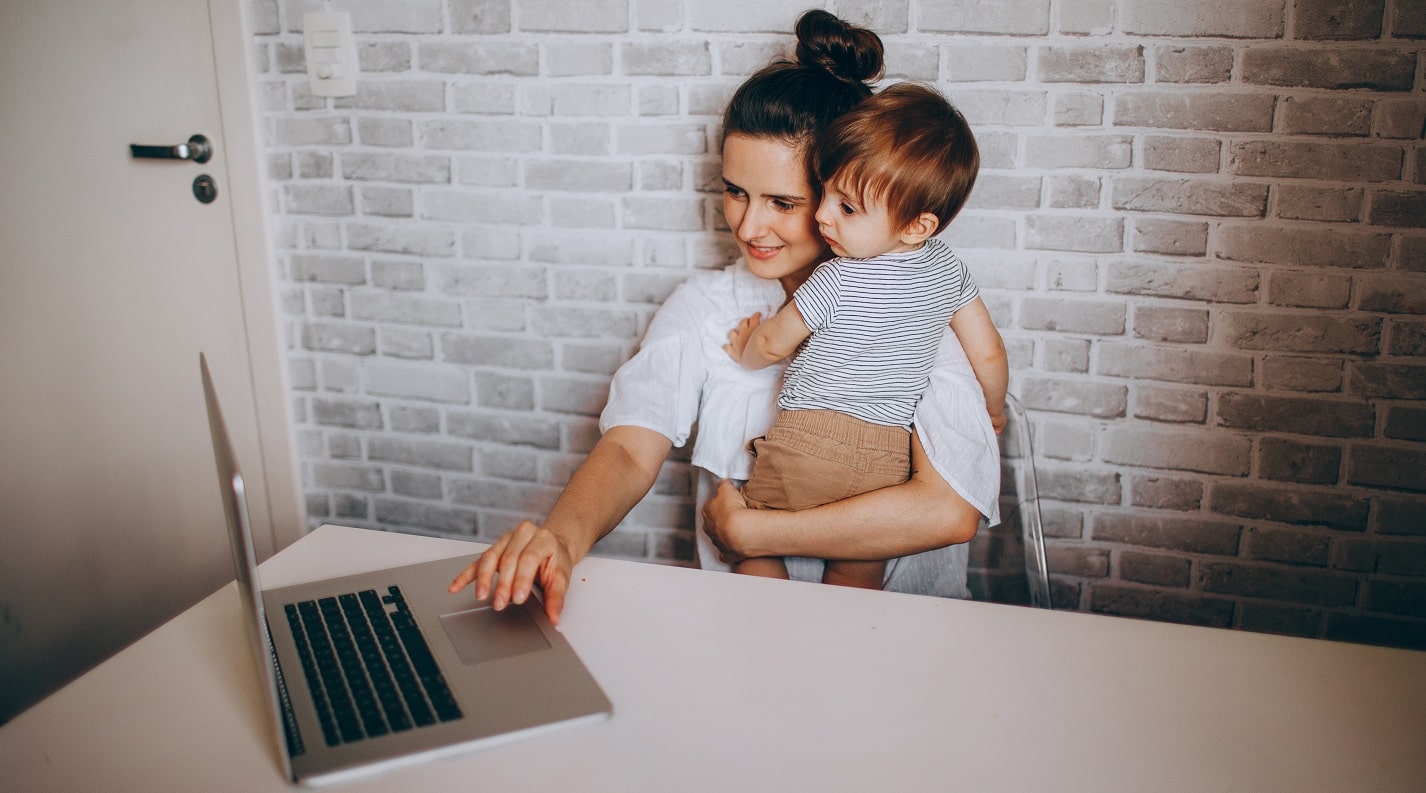 a picture showing a young mom working from home