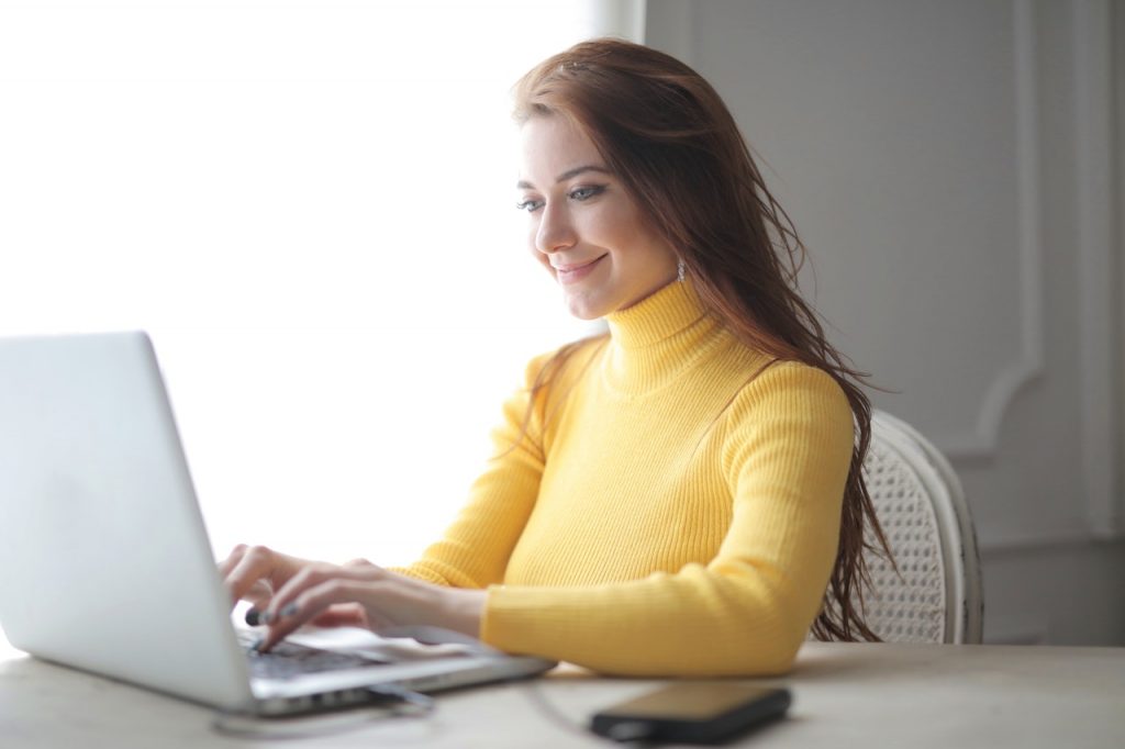 woman with a notebook cover for why get into ecommerce