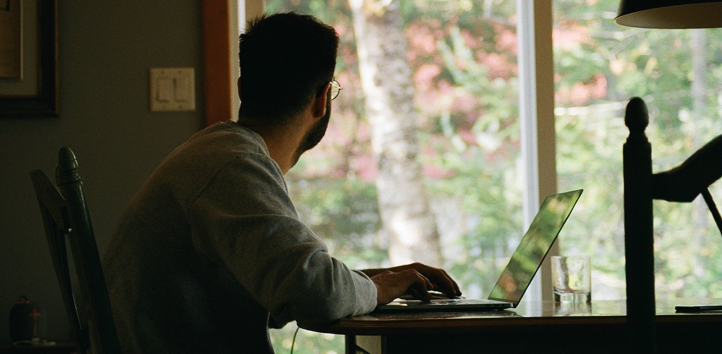 a picture showing a man who've started his ecommerce business and works from home