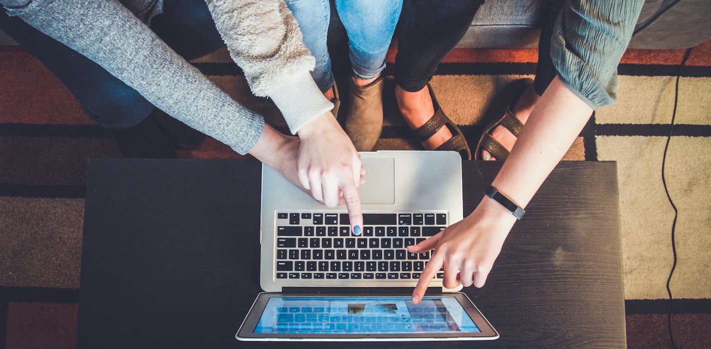 a picture showing three people shopping online