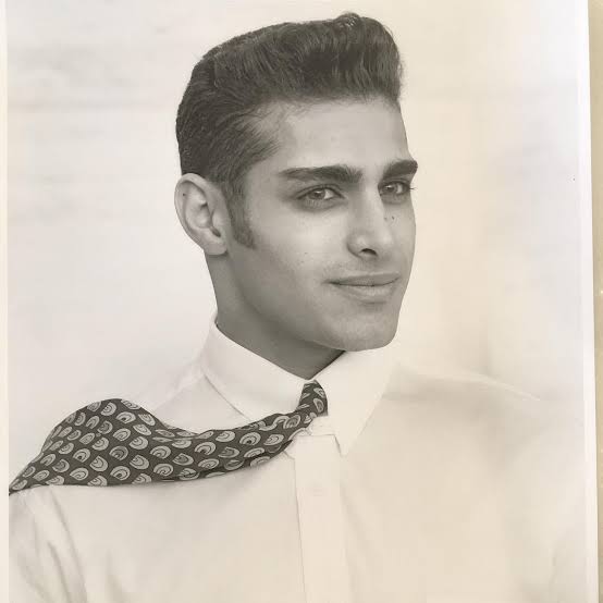 Photo of young Manny Khoshbin wearing a shirt and tie