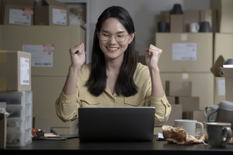 Photo of a woman making profits in ecommerce