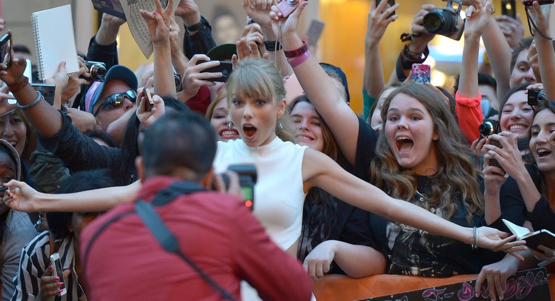 Picture of Taylor Swift Taking a picture with fans