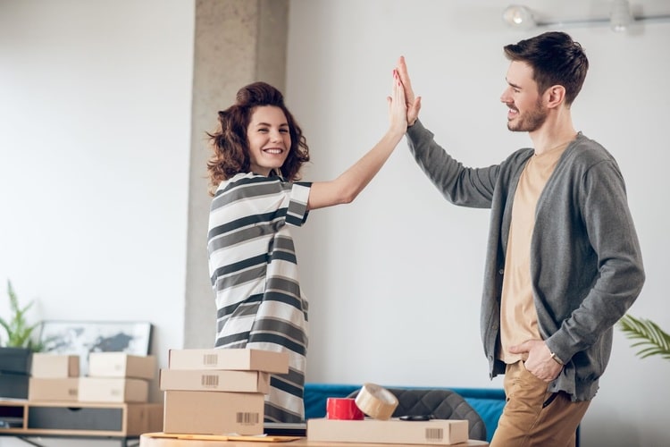 Picture of a man and a woman high fiving